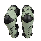 Pair of green and black knee pads on a white background