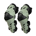 Pair of green and black knee pads on a white background