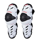 Pair of white and black knee guards with red branding on a white background