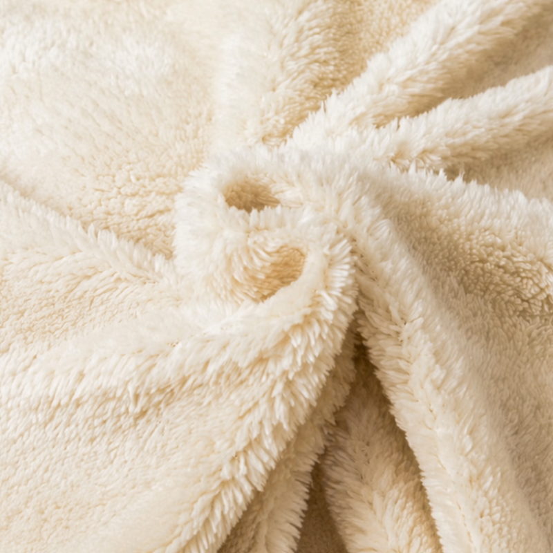 Two close-up views of a plush fabric product, likely a blanket or throw. The top panel shows a plaid pattern in orange and dark navy blue, while the bottom panel shows a soft cream sherpa side with a gathered fold.