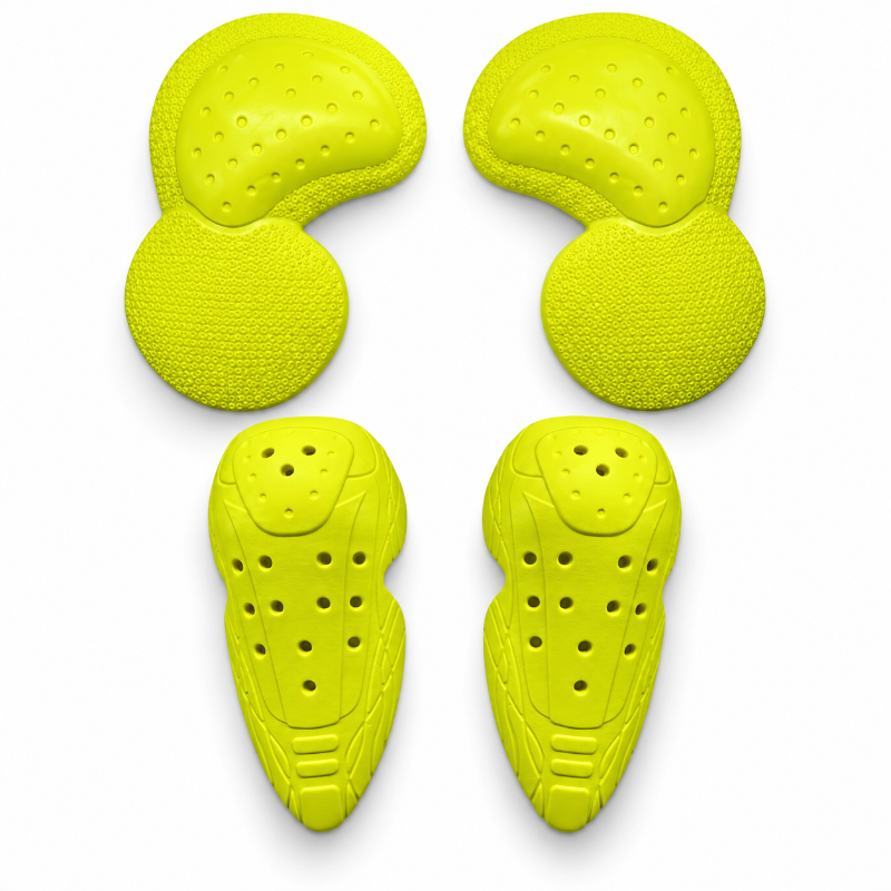 Four bright yellow protective sports pads arranged in a 2x2 grid on a clean white background. The set includes two elbow pads at the top and two shin guards at the bottom, each with textured surfaces and ventilation holes.