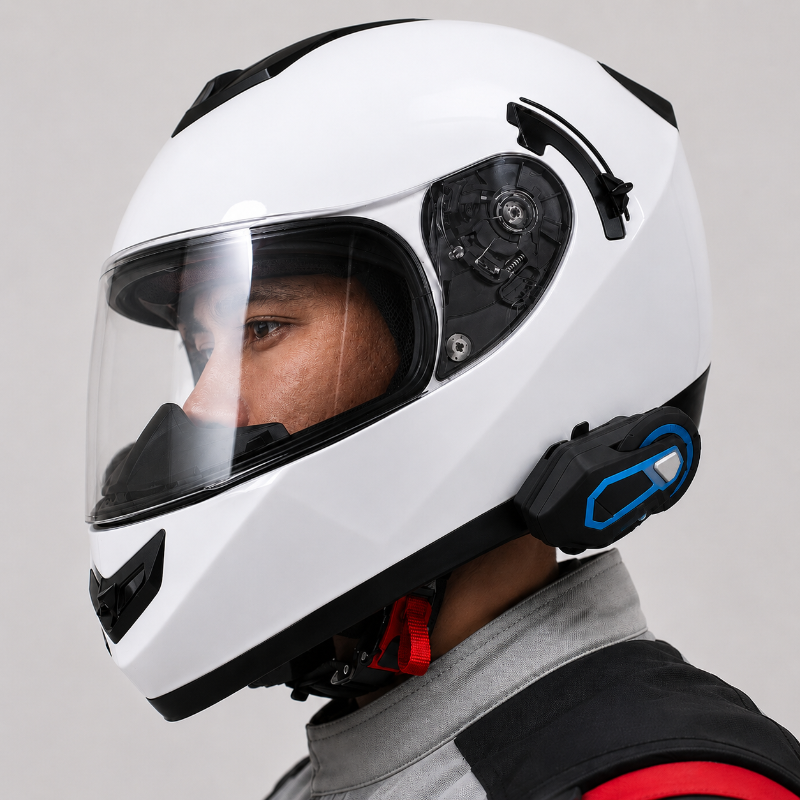 A close-up side profile of a white full-face motorcycle helmet with a clear visor, black trim, and blue accent details on the side module. A person is wearing it, with part of the face and neck visible against a plain light gray background.