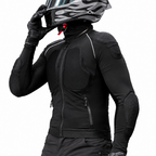 A person wearing a black full-face motorcycle helmet with a clear visor, black gloves, and a black long-sleeve riding jacket with integrated armor padding, shown against a plain white background.