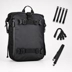 A black backpack shown on a light gray studio background with several black strap accessories arranged to the right. The backpack has multiple buckle straps and a top handle, and the accessories appear included with the product.