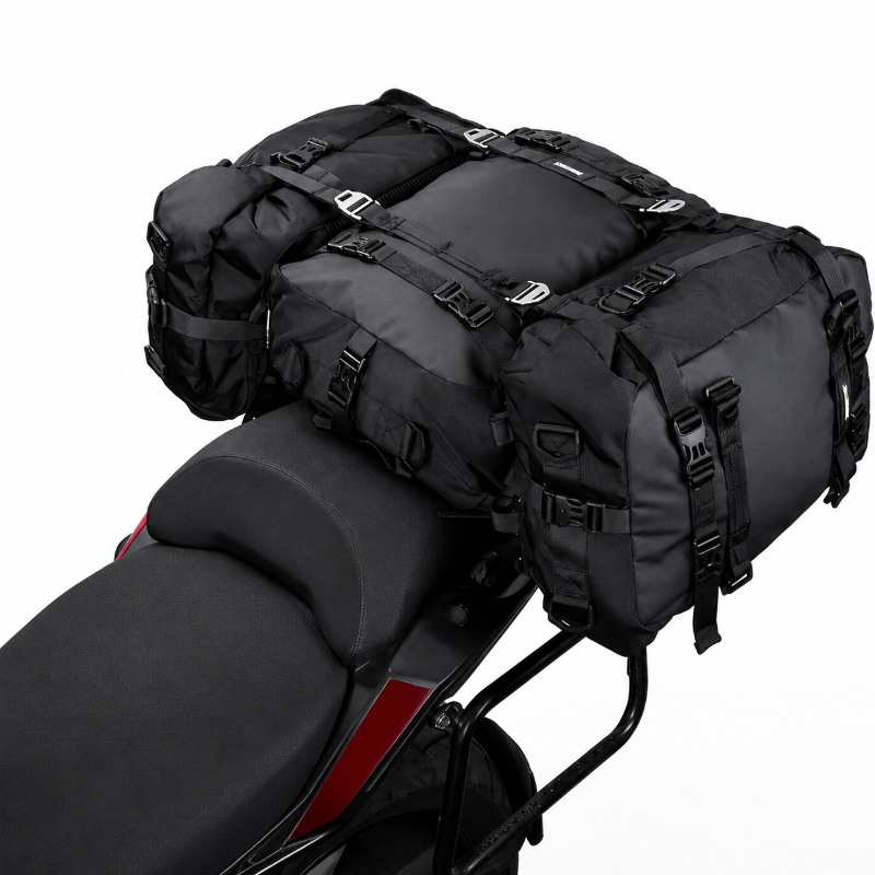 Black motorcycle saddle bag set with multiple straps and buckles, shown mounted on a motorcycle seat against a white background.
