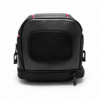 A black camera gear bag with a textured front panel, mesh window, and red accent lines, shown on a white background.