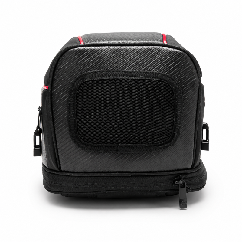 A black camera gear bag with a textured front panel, mesh window, and red accent lines, shown on a white background.