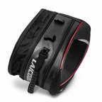A black bicycle pannier bag with a carbon fiber textured pattern, featuring a red accent stripe, a black shoulder strap  in white, and a black reflective panel on the side.
