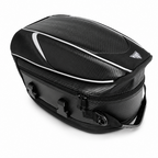 A black motorcycle rear rack bag with a textured carbon-fiber-style pattern, white piping accents, and a small triangular logo on the top right, shown on a white background.
