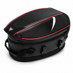 A black motorcycle tank bag with a carbon fiber pattern, red piping accents, and a white swoosh design on a clean white background.