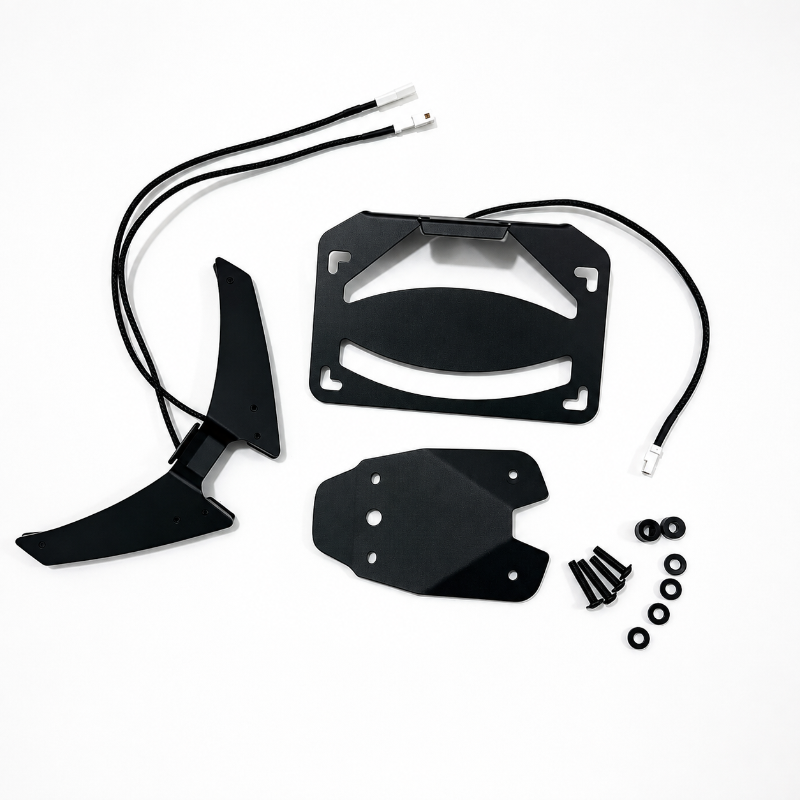 Black metal motorcycle license plate frame kit with mounting hardware and wiring harnesses, laid out on a white background.