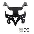 Black metal motorcycle license plate frame with mounting hardware, including four silver nuts and two black rubber gaskets, shown on a plain white background.