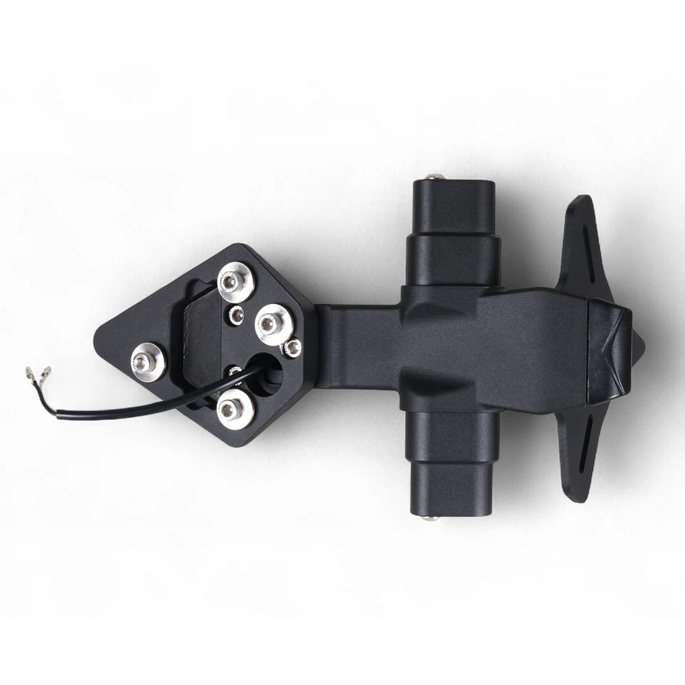 A black plastic and metal mounting bracket assembly with four silver screws and a short black wire lead, photographed on a clean white background.