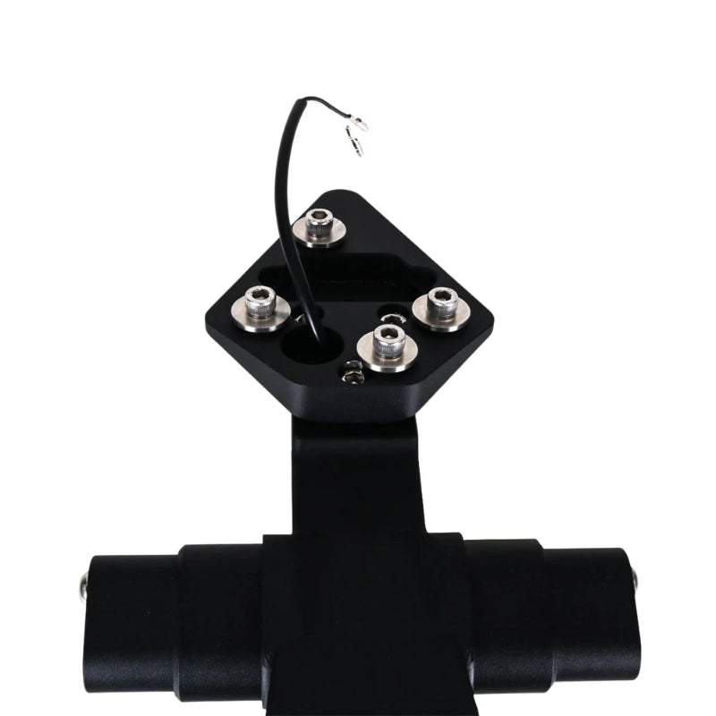 A black metal electrical terminal block with four silver screw terminals and a short black wire lead, shown on a plain white background.