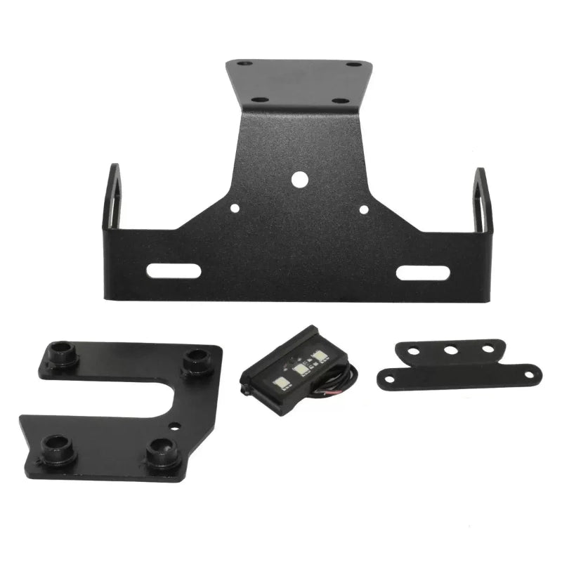 Black metal license plate frame kit with mounting brackets and a small wiring module, shown on a plain white background.