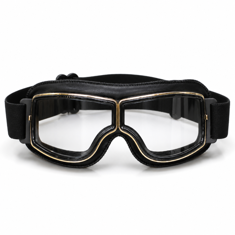 Black aviator-style goggles with a wide adjustable strap and gold trim around the clear lenses, shown on a plain white background.