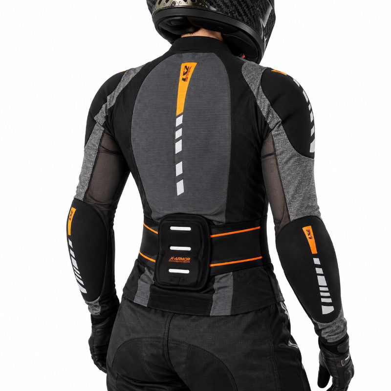 Rear view of a person wearing a black and gray motorcycle riding jacket with orange and white reflective details, a matching black riding belt with a pouch, and a black helmet against a white background.