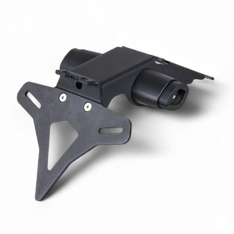 A black metal motorcycle license plate frame and mounting bracket assembly, photographed on a clean white background with a soft shadow.